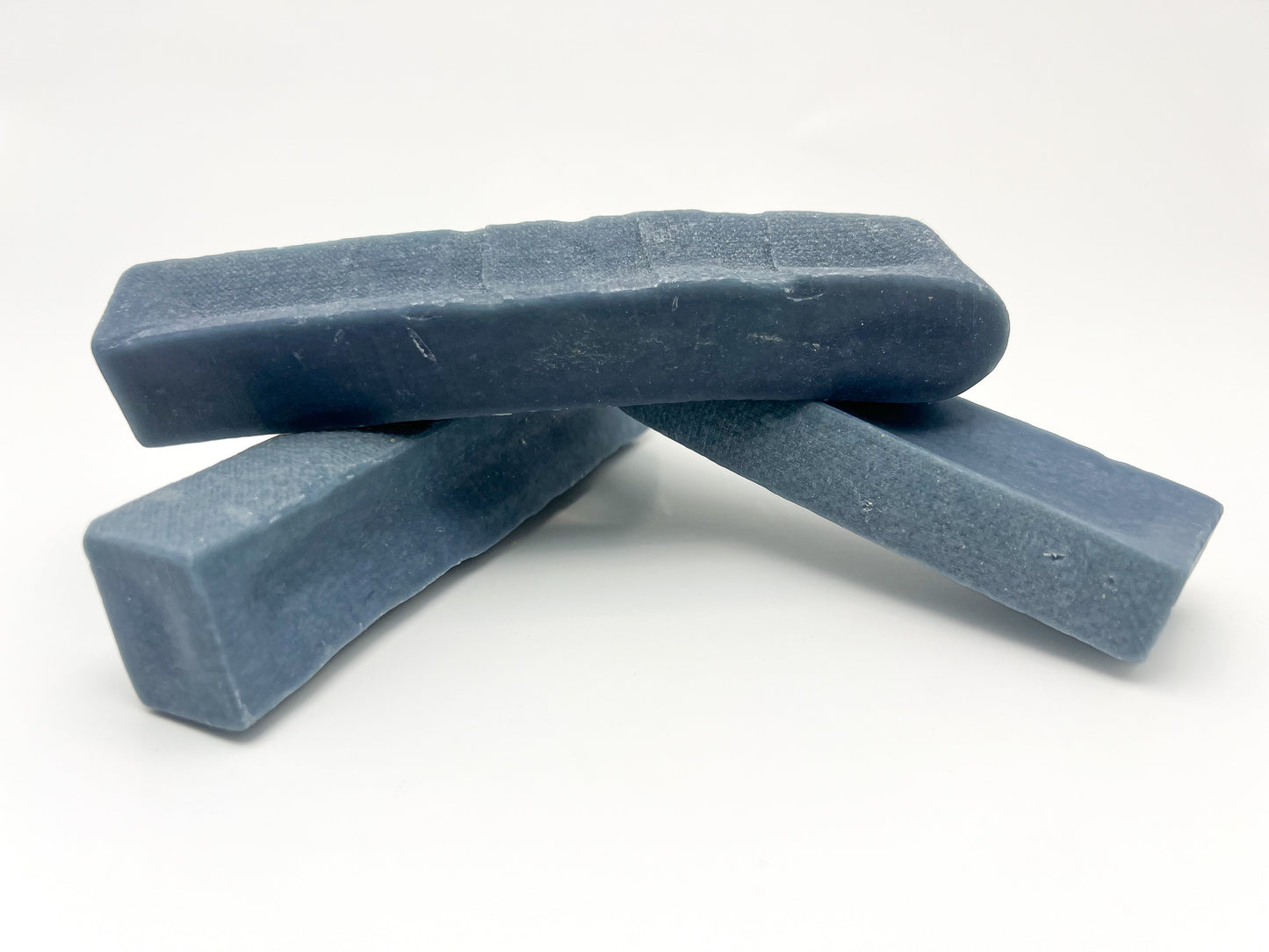 Image of three blue blueberry yak cheese on a white background