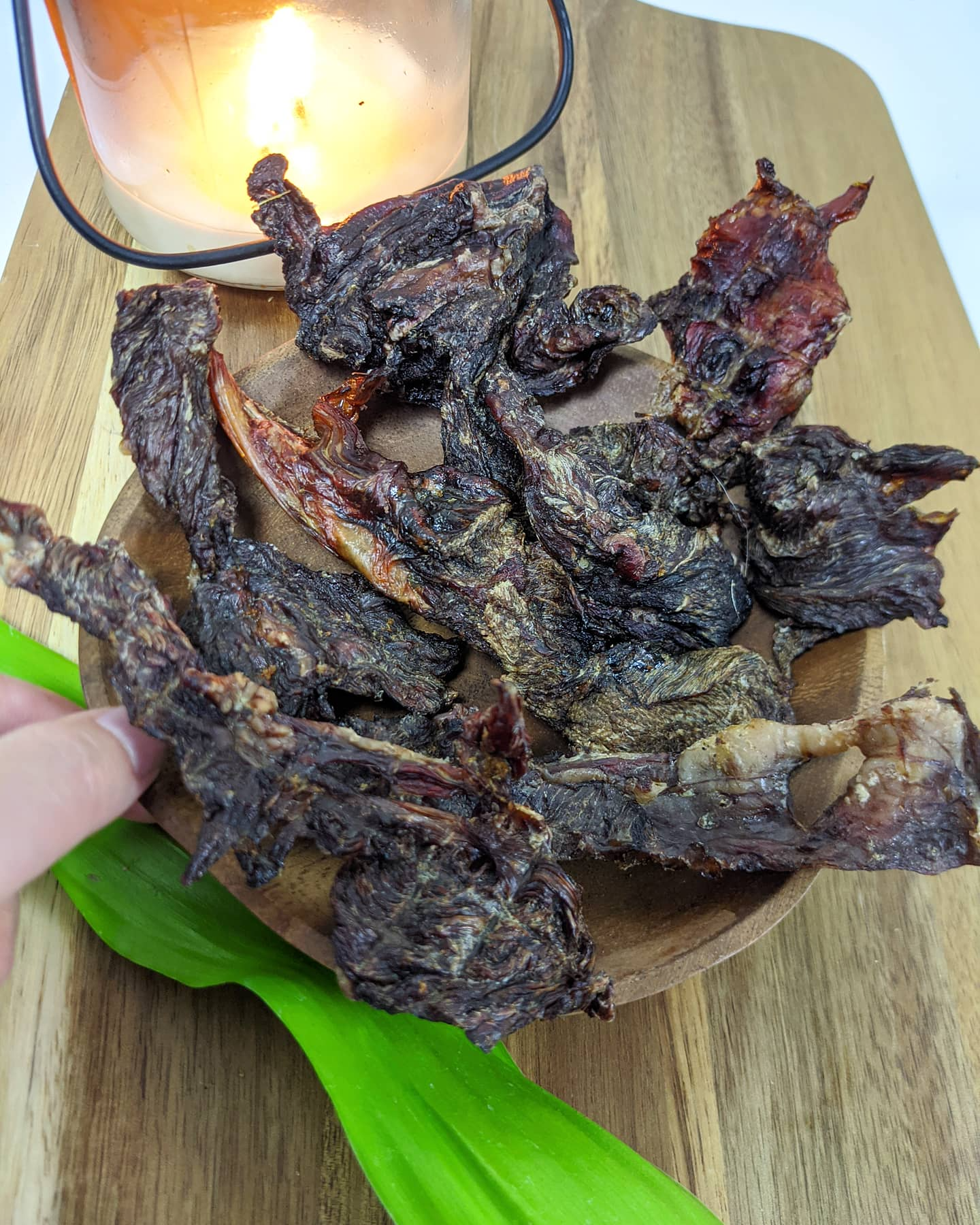 Image of camel treat pieces on a wood background 