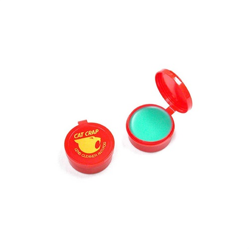 Image of a red container with green substance inside and "Cat Crap" logo on lid