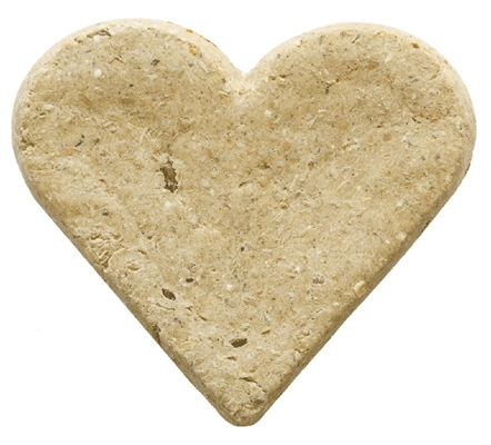 a light brown dog treat in the shape of a heart on a white background 