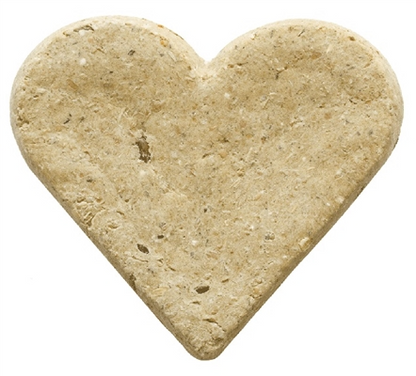 a light brown dog treat in the shape of a heart on a white background 