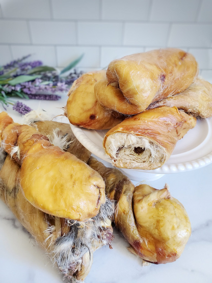 Image of six bunny baguette rolls on a white plate and a white marble surface 