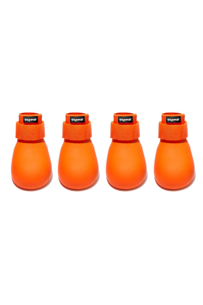 Four orange dog boots with Velcro straps